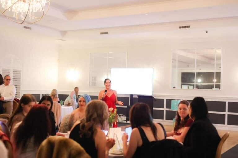 Chantal Gerardy speaking in front of business owners.